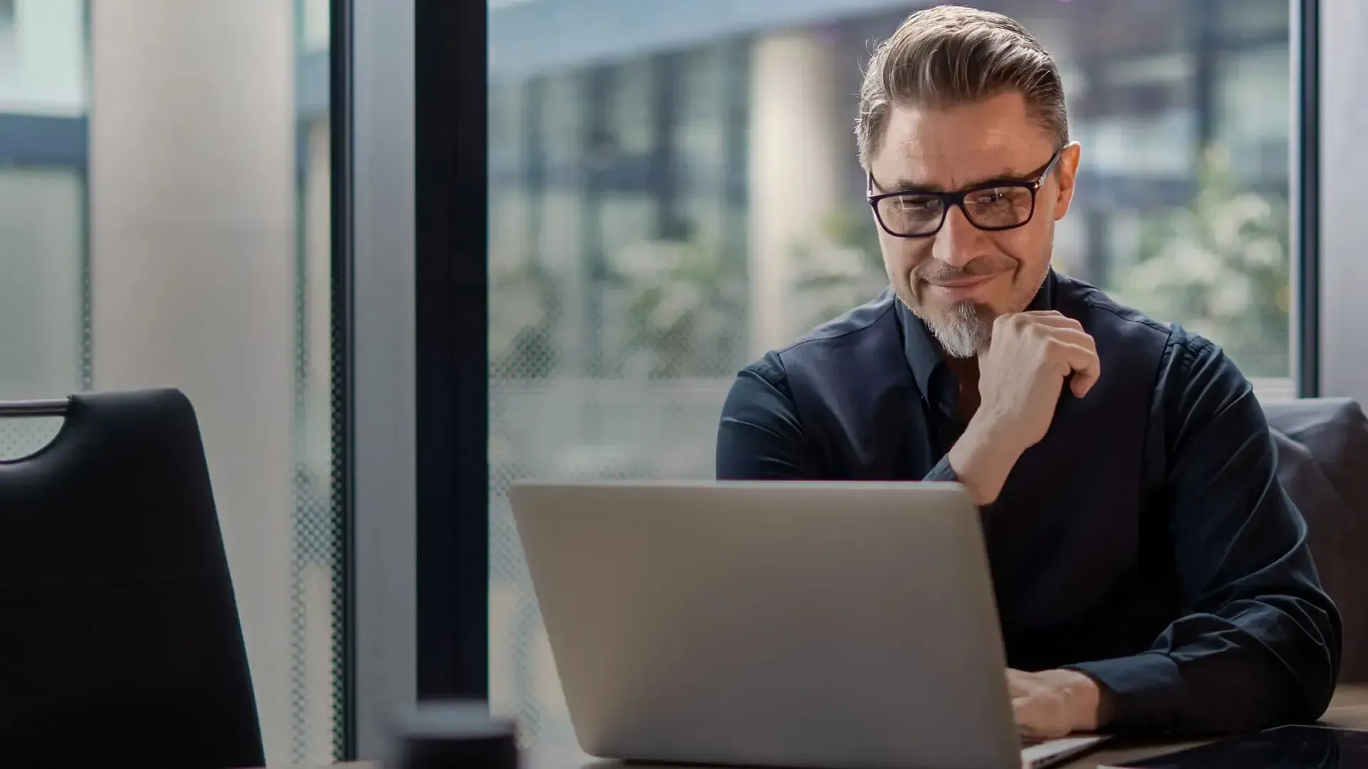 Professional businessman working on laptop